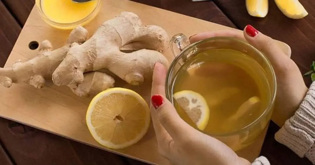 Refreshing homemade Ginger Water with sliced ginger root in a glass